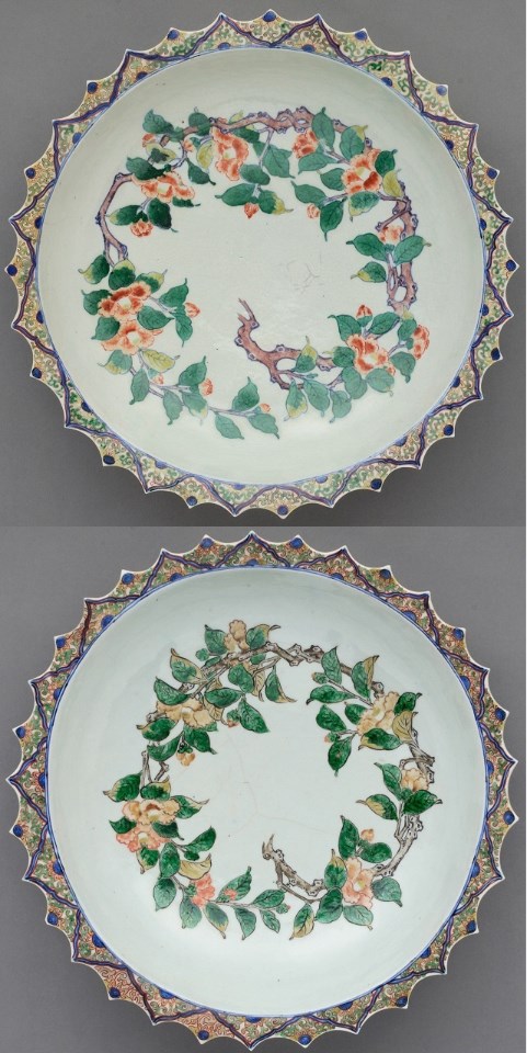 明るい乳白色の磁器肌の上に、鮮やかな緑の葉とオレンジ色の椿の花が円を描くように伸びやかな筆致で描かれており、波打つような縁取りには緻密な幾何学文様が施された、江戸時代の洗練された美意識と高い工芸技術が同居する一対の磁器大皿の写真